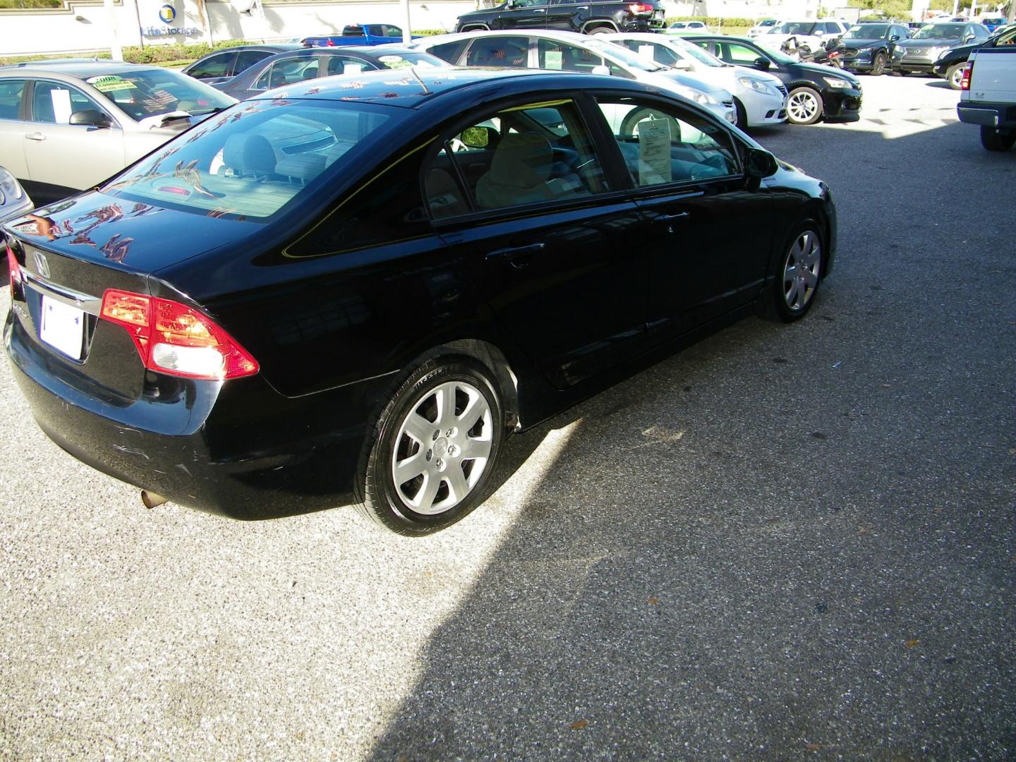 2011 Black /Gray Honda Civic LX Sedan 5-Speed AT (19XFA1F5XBE) with an 1.8L L4 SOHC 16V engine, 5-Speed Automatic transmission, located at 4000 Bee Ridge Road, Sarasota, FL, 34233, (941) 926-0300, 27.298664, -82.489151 - Photo#7